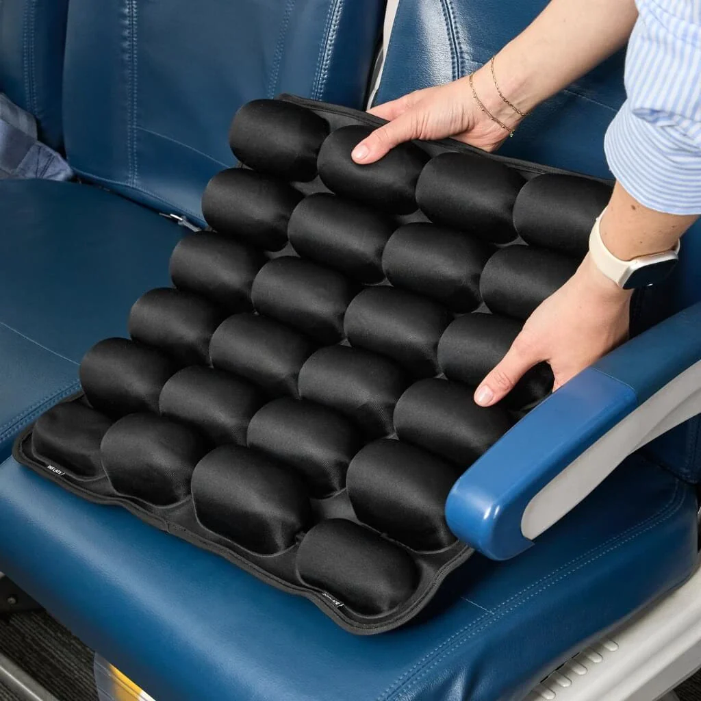 Inflating the Sondur cushion at an airport gate